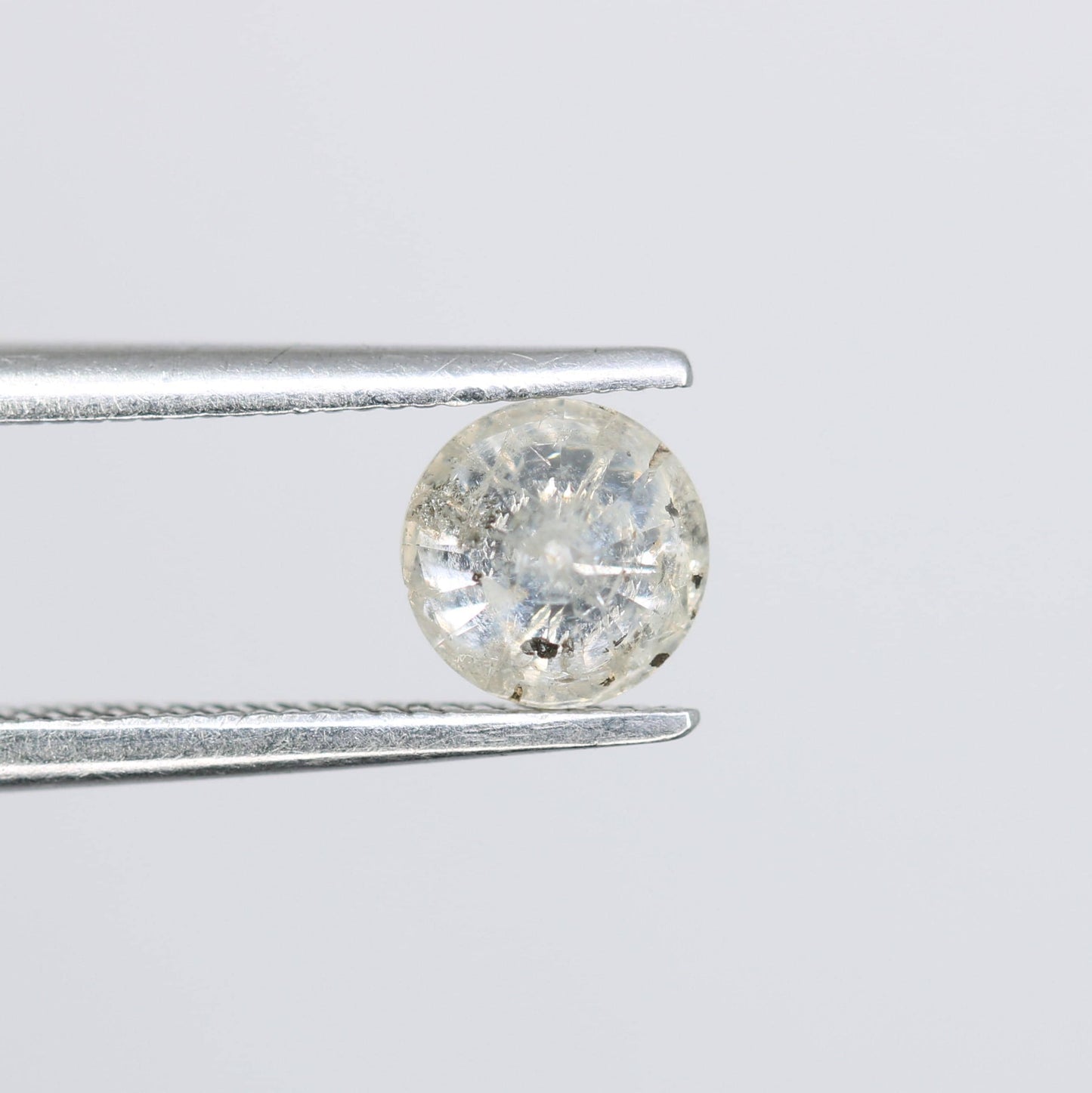 Natural Polished Salt and Pepper Round Brilliant Diamond - 0.59 Carat Opaque Gemstone for Unique Engagement Rings and Custom Jewelry