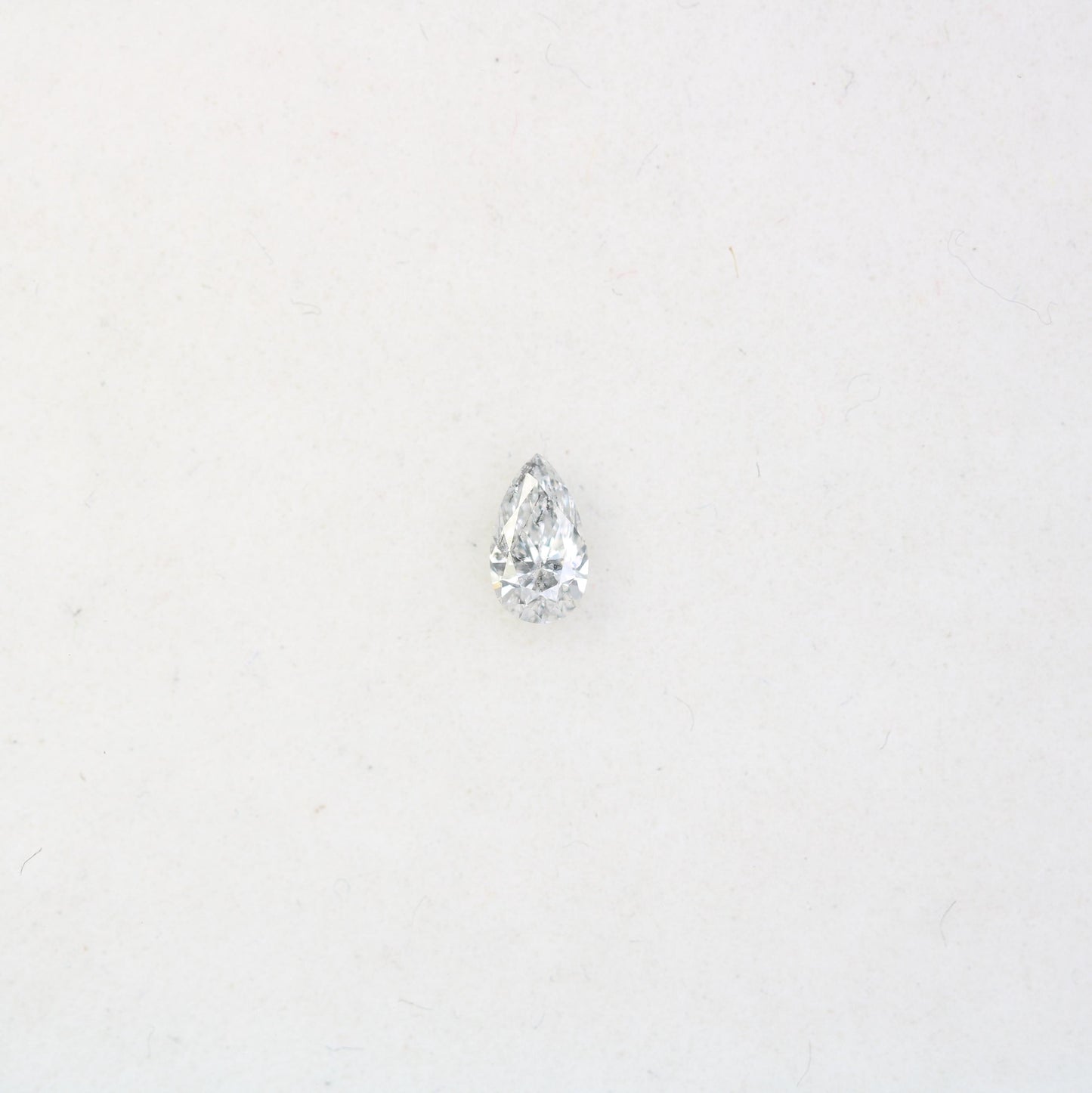 0.16 CT Elegant Natural White Salt and Pepper Pear Shape Diamond - Unique Loose Gemstone for Engagement Rings and Custom Jewelry Designs.