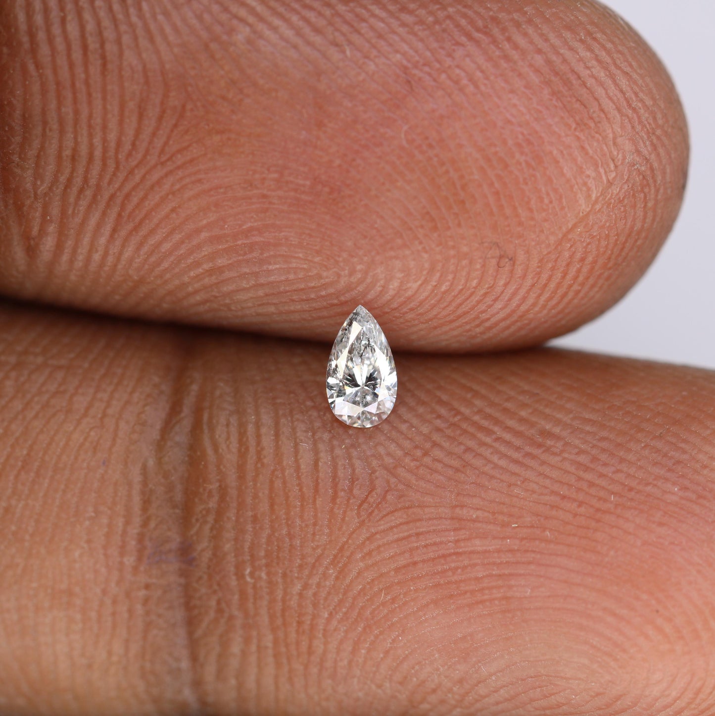 0.16 CT Elegant Natural White Salt and Pepper Pear Shape Diamond - Unique Loose Gemstone for Engagement Rings and Custom Jewelry Designs.