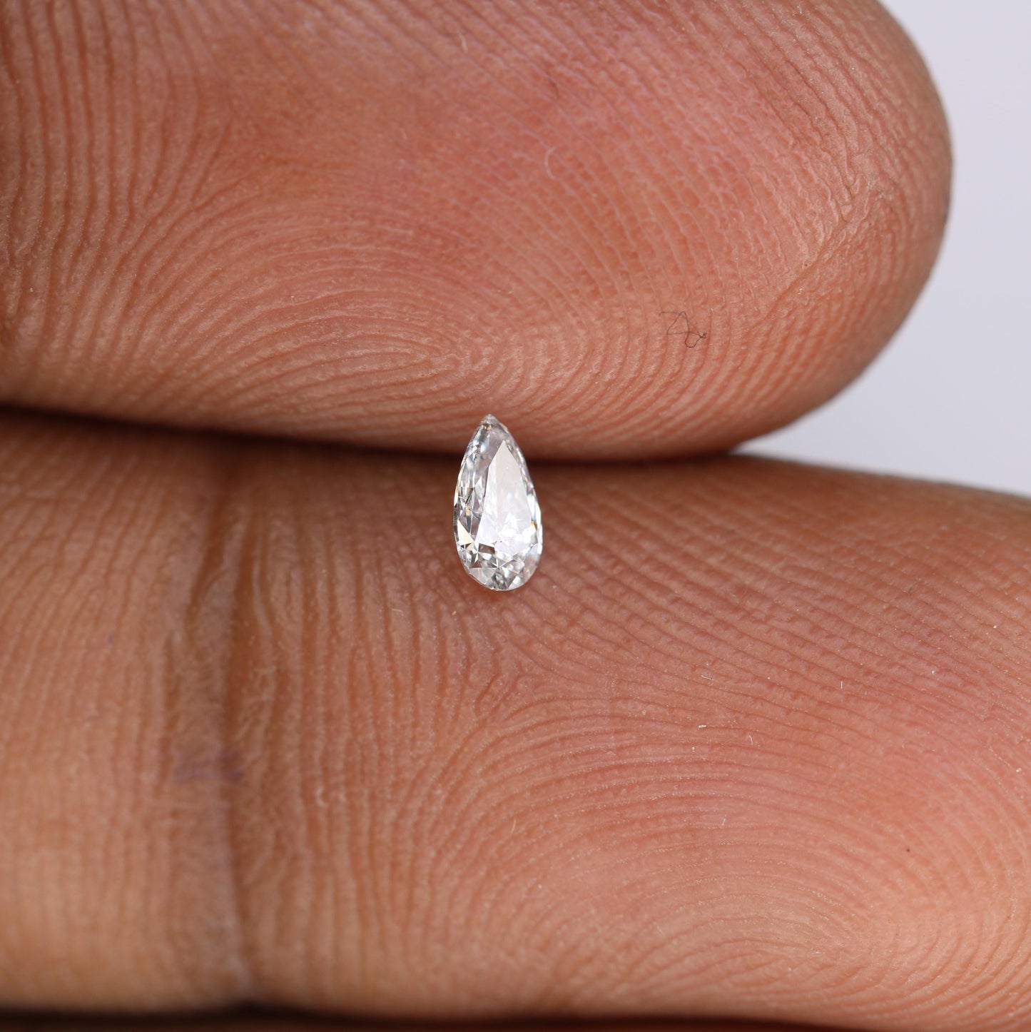0.16 CT Elegant Natural White Salt and Pepper Pear Shape Diamond - Unique Loose Gemstone for Engagement Rings and Custom Jewelry Designs.