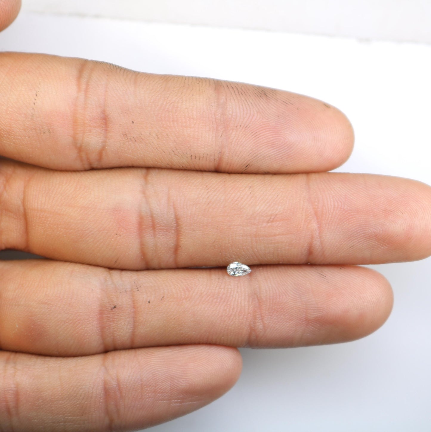 0.16 CT Elegant Natural White Salt and Pepper Pear Shape Diamond - Unique Loose Gemstone for Engagement Rings and Custom Jewelry Designs.