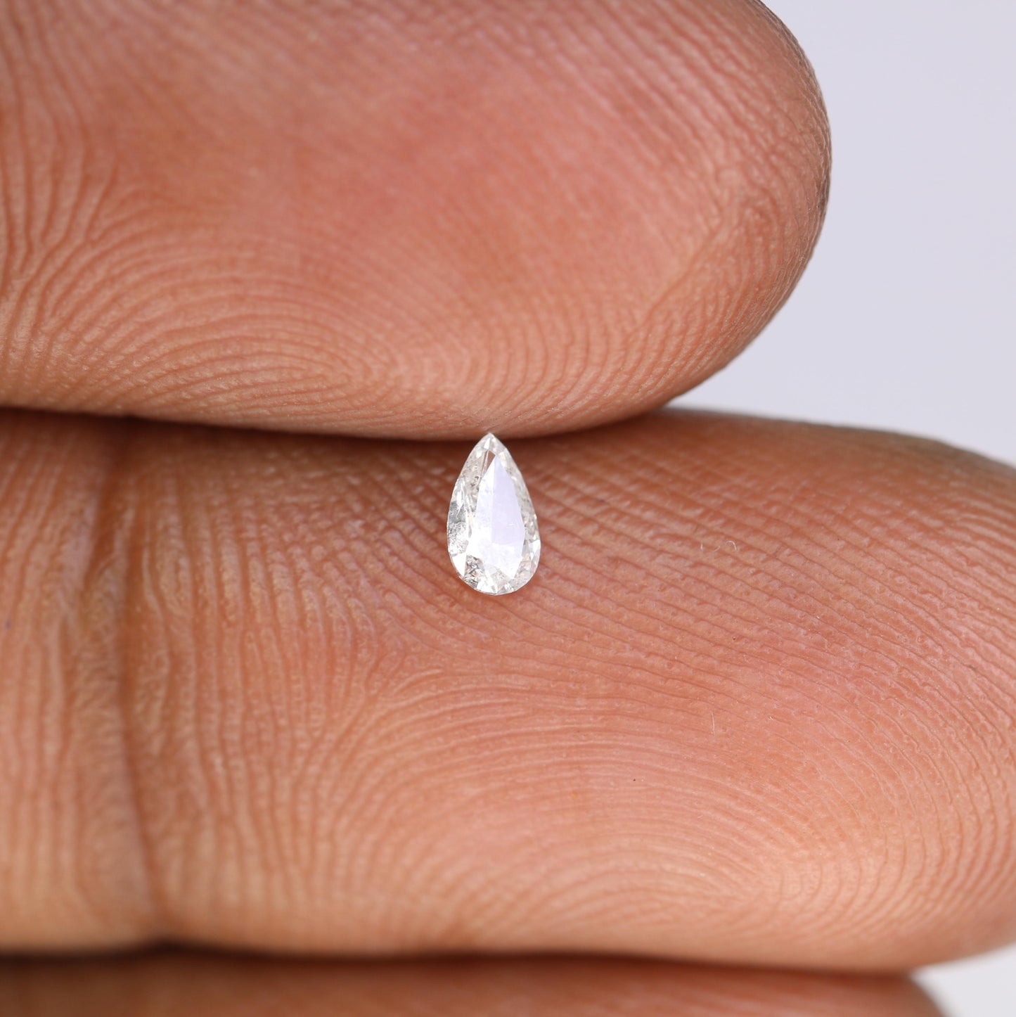0.13 CT Natural White Salt and Pepper Pear Shape Diamond - Stunning Loose Gemstone Perfect for Custom Rings and Unique Jewelry Designs.
