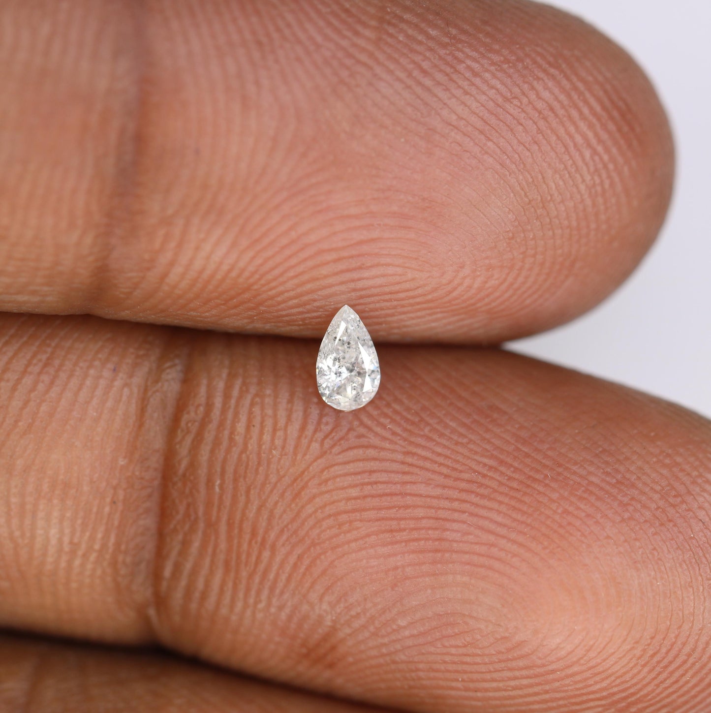 0.13 CT Natural White Salt and Pepper Pear Shape Diamond - Stunning Loose Gemstone Perfect for Custom Rings and Unique Jewelry Designs.