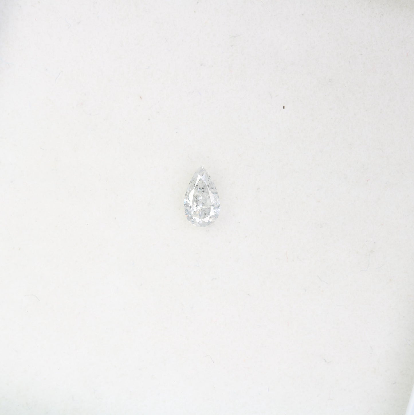 0.13 CT Natural White Salt and Pepper Pear Shape Diamond - Stunning Loose Gemstone Perfect for Custom Rings and Unique Jewelry Designs.