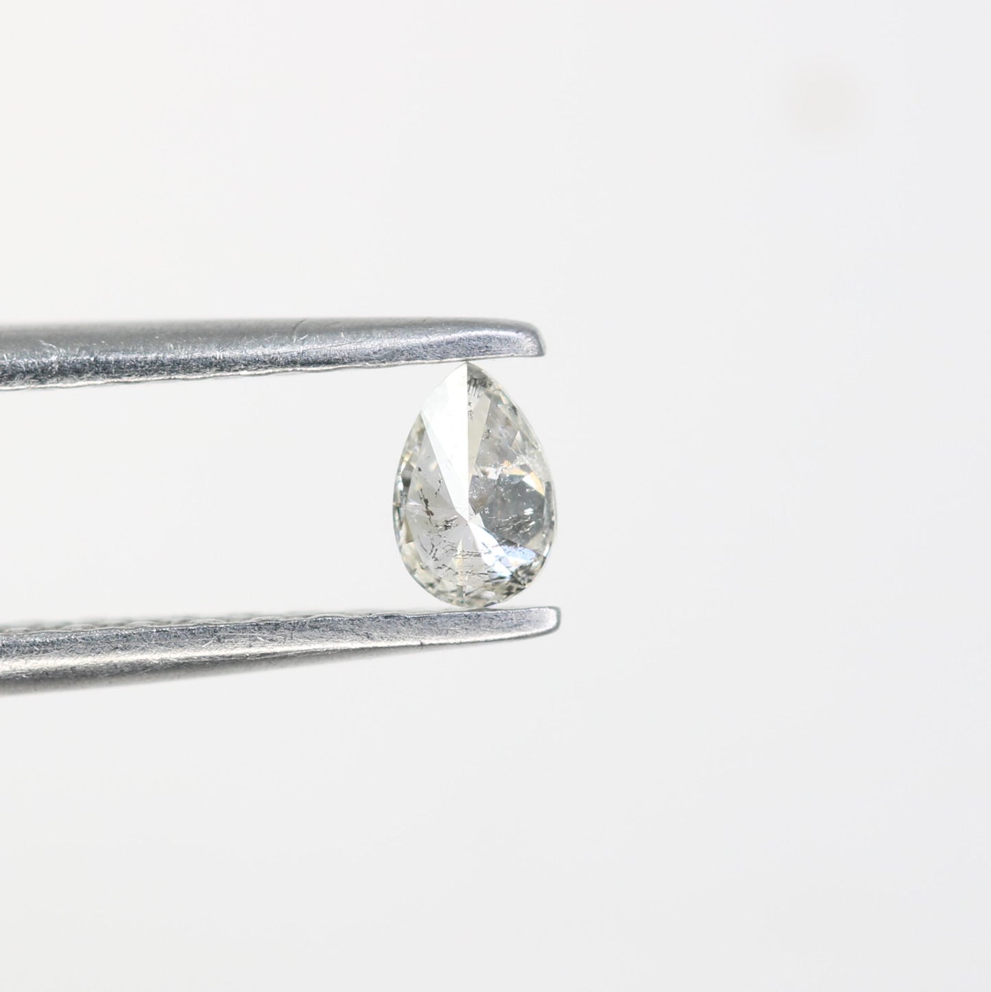 0.15 CT Raw Natural Pear Shape Salt and Pepper Diamond - Unique White Loose Stone Perfect for Custom Engagement Rings and Jewelry Designs.