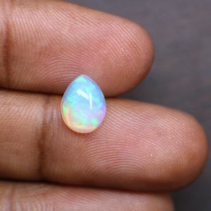 1.49 CT Rainbow Blue Opal Pear Shape Gemstone for Engagement Ring - Stunning Wedding Ring and Gift for Her with Gold Ring and Diamonds