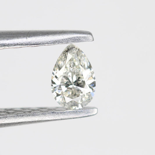 0.15 CT Raw Natural Pear Shape Salt and Pepper Diamond - Unique White Loose Stone Perfect for Custom Engagement Rings and Jewelry Designs.