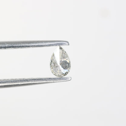 0.15 CT Raw Natural Pear Shape Salt and Pepper Diamond - Unique White Loose Stone Perfect for Custom Engagement Rings and Jewelry Designs.
